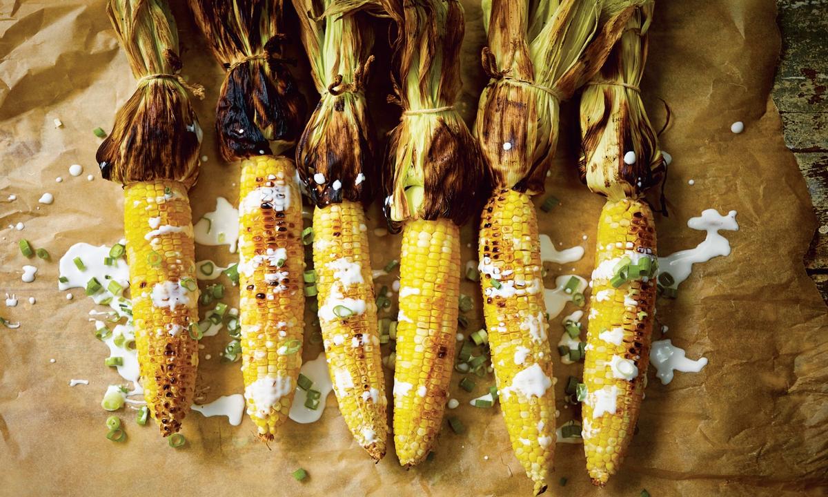 "Grilled corn is already good on its own," writes Leela Punyaratabandhu, "but what makes pot ang special is the coconut sauce that coats it"—velvety, at once sweet and salty, and spiked with scallions. (Photo by David Loftus)