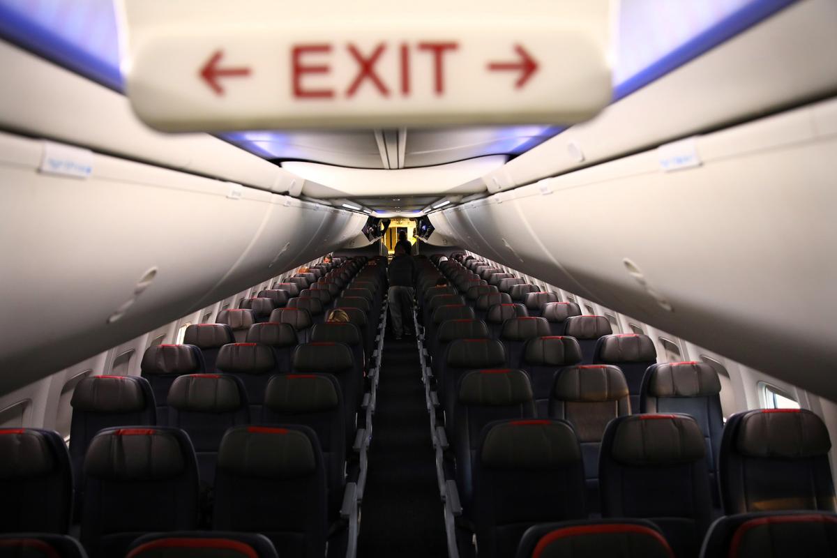 Rows of empty seats of an American Airlines flight in Washington on March 18, 2020. (Carlos Barria/Reuters)