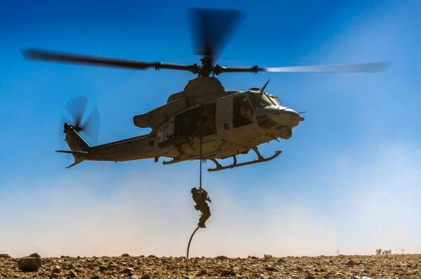 A U.S. Special Forces Green Beret Soldier, assigned to 7th Special Forces Group (Airborne), Operational Detachment-A, rappels from a UH-1Y Huey helicopter while conducting an air assault mission during Integrated Training Exercise 2-16 at Marine Corps Air Ground Combat Center, Twentynine Palms, Calif., on Feb. 9, 2016. (U.S. Air Force photo by Tech Sgt. Efren Lopez/Released)