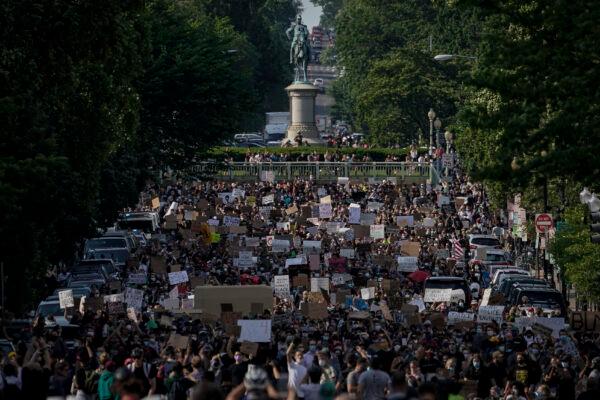 Demonstrators march toward Lafayette Park and the White House to protest against police brutality and the death of George Floyd, in Washington on June 2, 2020. (Drew Angerer/Getty Images)