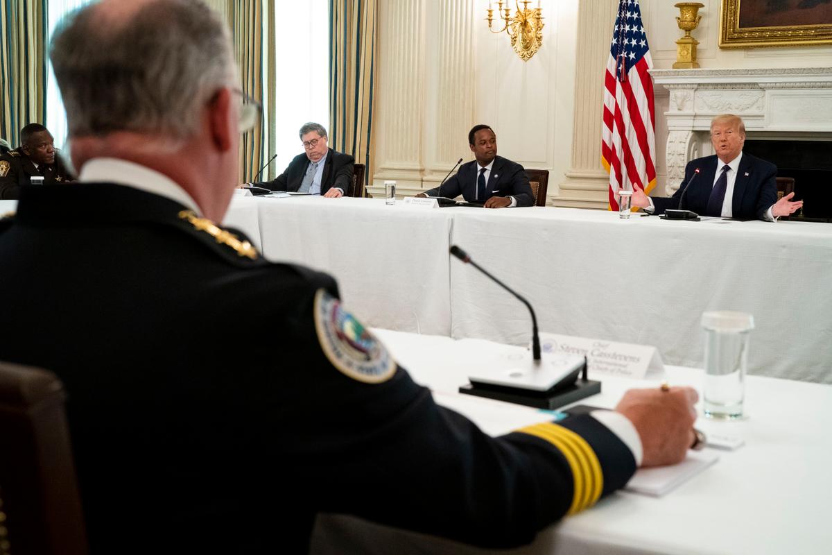 President Donald Trump makes remarks as he participates in a roundtable with law enforcement officials, Attorney General William Barr (L), and Daniel J, Cameron Attorney General for the Commonwealth of Kentucky (2nd L) in the State Dining Room of the White House in Washington on June, 8, 2020. (Doug Mills/Pool/Getty Images)