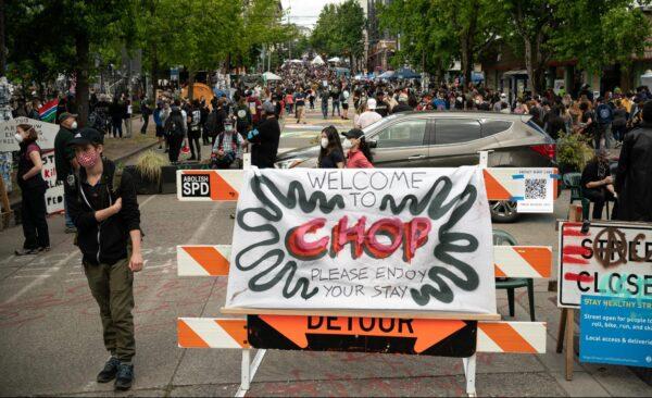 A sign welcomes visitors on East Pine Street during ongoing Black Lives Matter events at the so-called "Capitol Hill Organized Protest" in Seattle, Wash., on June 14, 2020. (David Ryder/Getty Images)