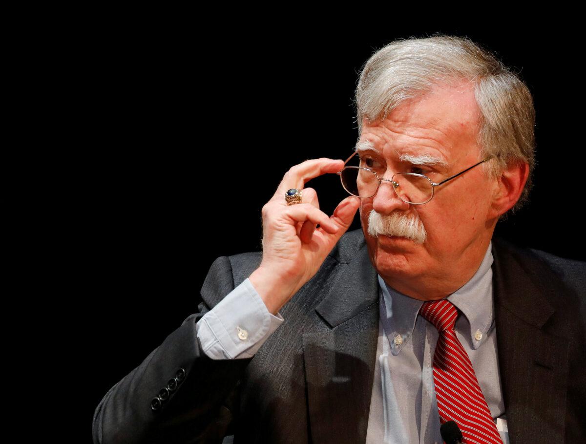 Former national security advisor John Bolton adjusts his glasses during his lecture at Duke University in Durham, N.C., on Feb. 17, 2020. (Jonathan Drake/Reuters)