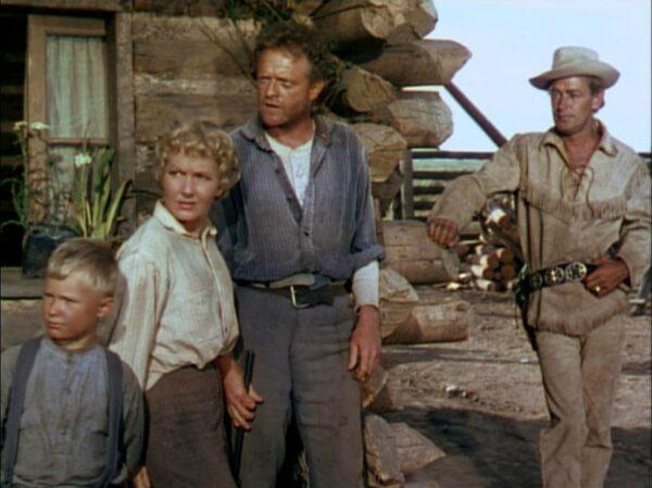 (L–R) Brandon De Wilde, Jean Arthur, Van Heflin as homesteaders and Alan Ladd as a drifter, in “Shane.” (Paramount Pictures)