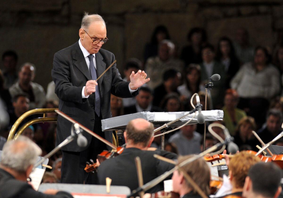 Italian composer Ennio Morricone, conducts with the Budapest Symphonic Orchestra - Gyor, performing his best film themes together with the Macedonian Opera Choir, on the opening eve of the 49th Ohrid Summer Festival at the Ancient Theatre in Ohrid, in southwestern Macedonia, on July 12, 2009. (Boris Grdanoski/ file/AP Photo)