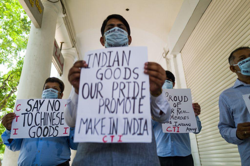Anti-China protesters display placards urging citizens to boycott Chinese goods at a market in New Delhi on June 17, 2020. (Jewel Samad/AFP via Getty Images)
