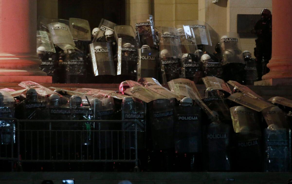 Serbian riot police guard the Serbian parliament building during a protest in Belgrade, Serbia, on July 10 2020. (Darko Vojinovic/AP Photo)