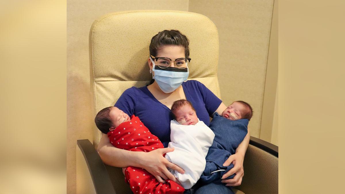 Maggie Sillero holds her triplets. (Courtesy of The Woman's Hospital of Texas)