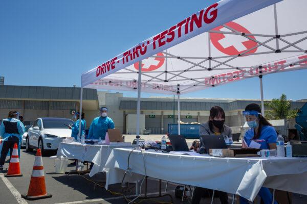 Nurses work at a new COVID-19 testing site at the Anaheim Convention Center in Anaheim, Calif., on July 15, 2020. (John Fredricks/The Epoch Times)