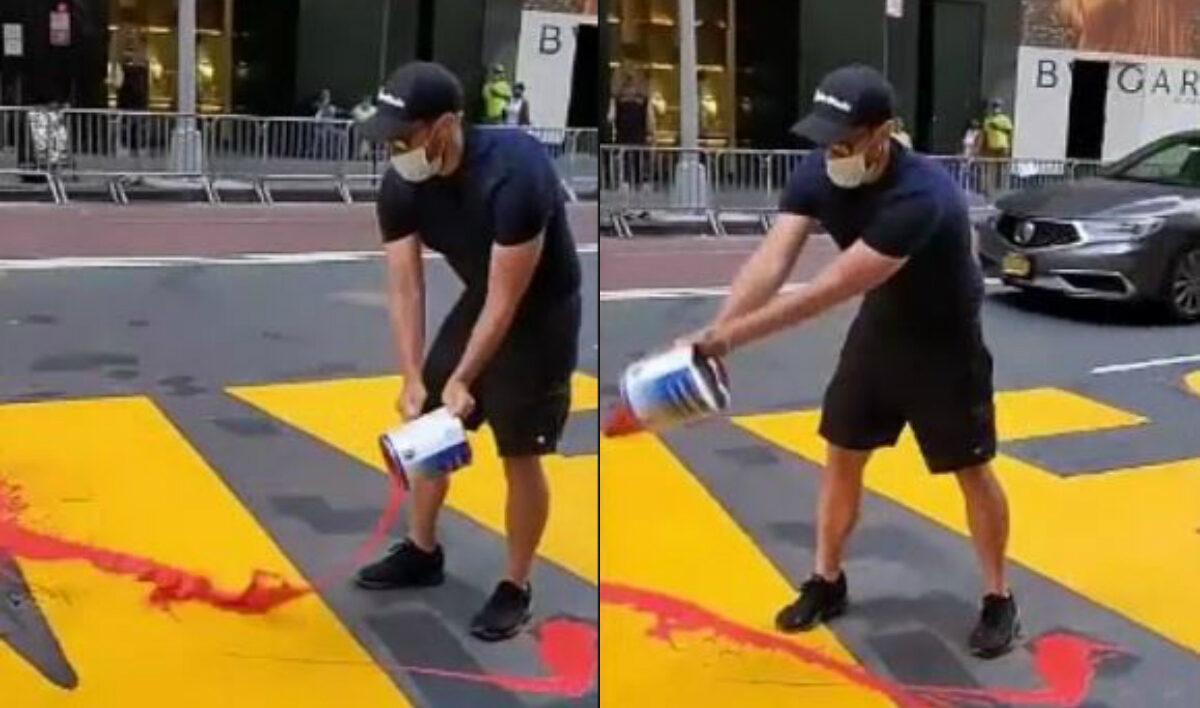 A man dumps red paint on the "Black Lives Matter" mural in New York City on July 13, 2020. (NYPD)