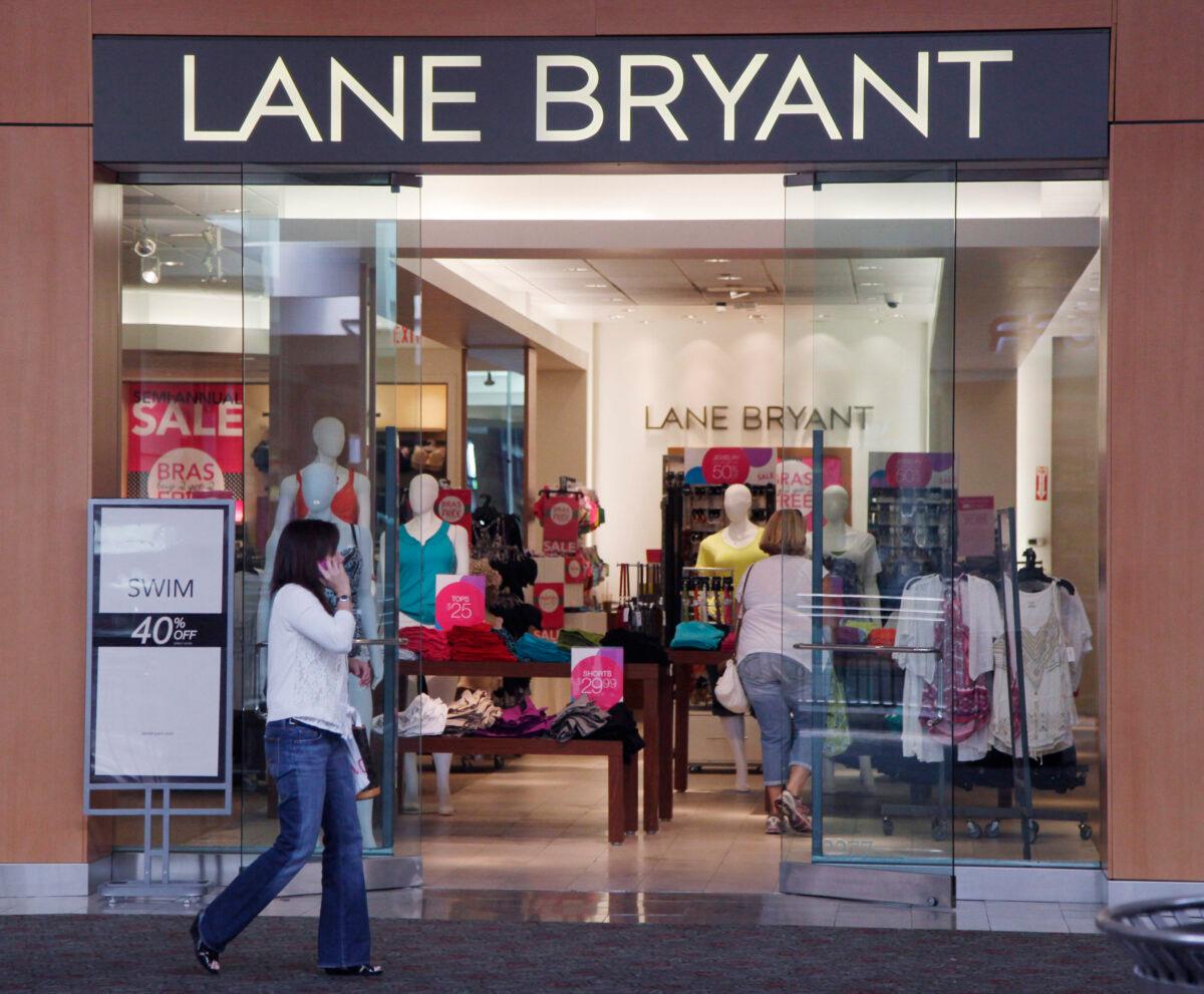 A woman walks past a Lane Bryant store in San Jose, Calif., on June 15, 2012. (Paul Sakuma/ File/AP Photo)