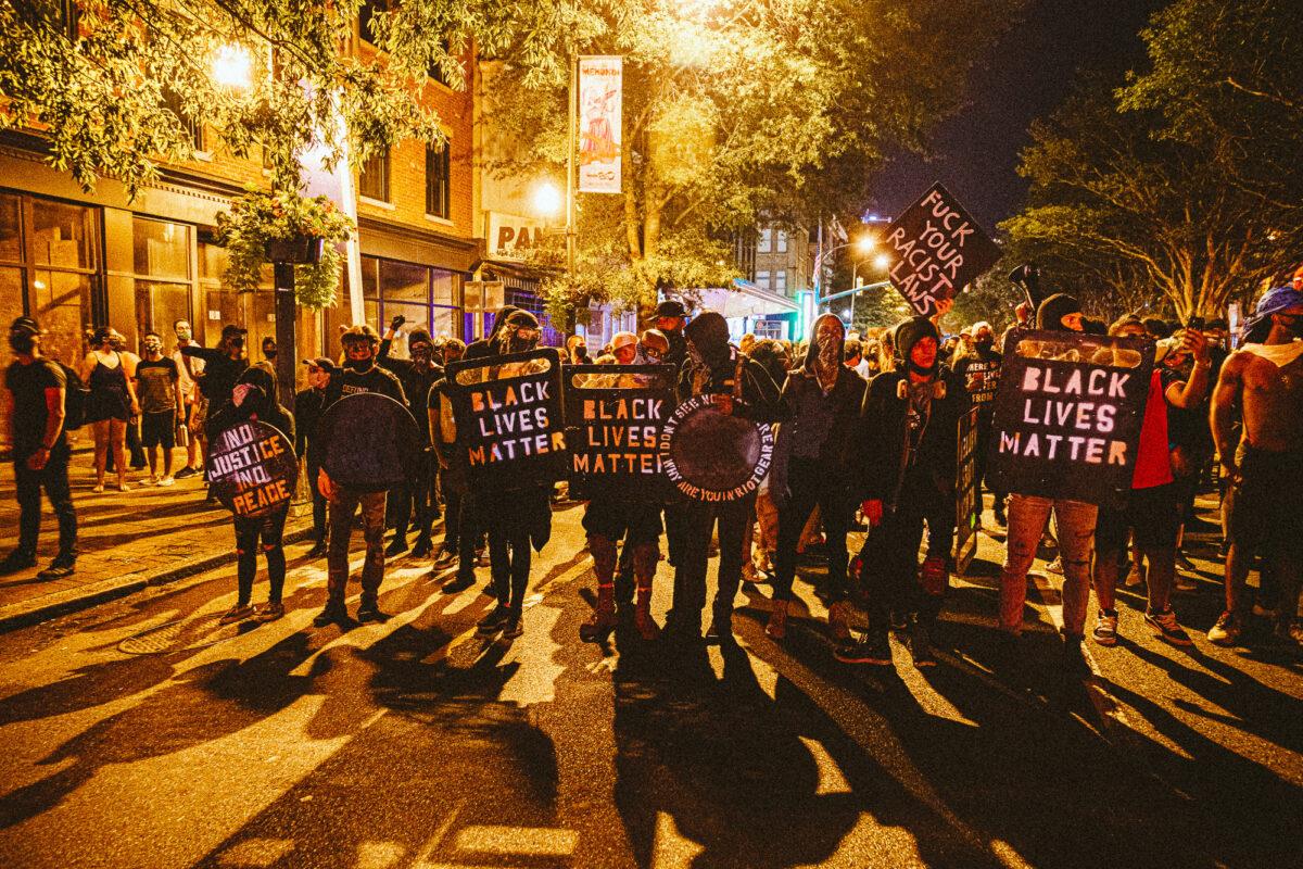 People carrying homemade Black Lives Matter shields march in front of protesters in Richmond, Va., on July 25, 2020. (Eze Amos/Getty Images)