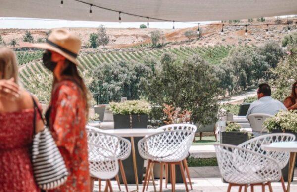 Visitors to Akash Winery in Temecula Valley, Calif., wear masks and stay out on the patio as indoor operations are prohibited amid the COVID-19 pandemic. (Courtesy of Akash Winery)