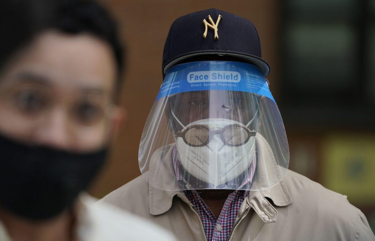 A man in a face shield in New York on May 18, 2020. (Timothy A. Clary/AFP/Getty Images)