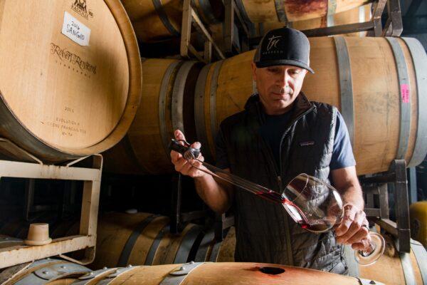 Robert Renzoni draws wine from a barrel at Robert Renzoni Vineyards in Temecula Valley, Calif. (Courtesy of Temecula Valley Winegrowers Association)
