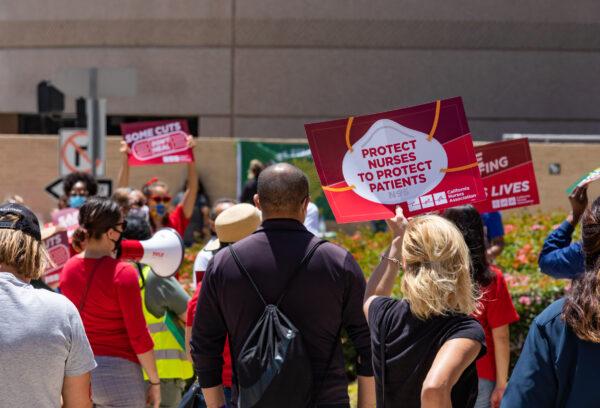 Nurses and other health care workers gather to protest working conditions due to COVID-19 near the entrance of the UCLA Medical Center in Los Angeles, Calif., on July 29, 2020. (John Fredricks/The Epoch Times)