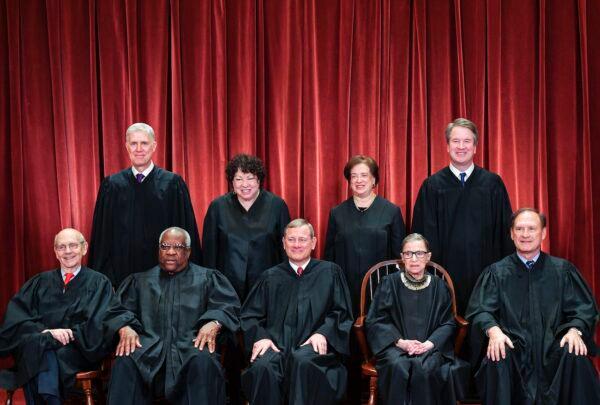 Justices of the U.S. Supreme Court pose for their official photo at the Supreme Court in Washington, on Nov. 30, 2018. Standing from left: Associate Justice Neil Gorsuch, Associate Justice Sonia Sotomayor, Associate Justice Elena Kagan and Associate Justice Brett Kavanaugh. Seated from left to right, bottom row: Associate Justice Stephen Breyer, Associate Justice Clarence Thomas, Chief Justice John Roberts, Associate Justice Ruth Bader Ginsburg and Associate Justice Samuel Alito. (Mandel Ngan/AFP via Getty Images)