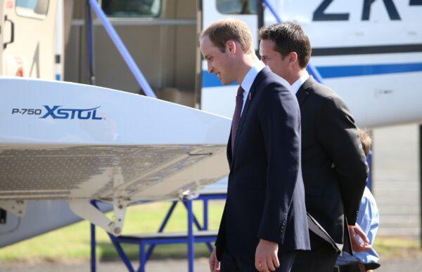 Britain's Prince William (C) unveils the latest model P-750 XSTOL aircraft during his visit to Pacific Aerospace in Hamilton on April 12, 2014 (Fiona Goodall/AFP via Getty Images)