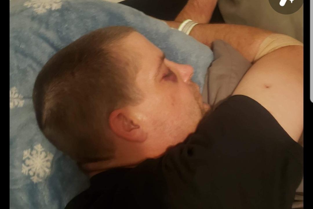 Adam Haner resting at home in an undated photograph published on Aug. 17, 2020. (Adam Haner Fund/GoFundMe)