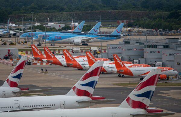 British Airlines, EasyJet, and TUI aircraft are pictured at London Gatwick Airport in London on June 9, 2020. (Chris J Ratcliffe/Getty Images)