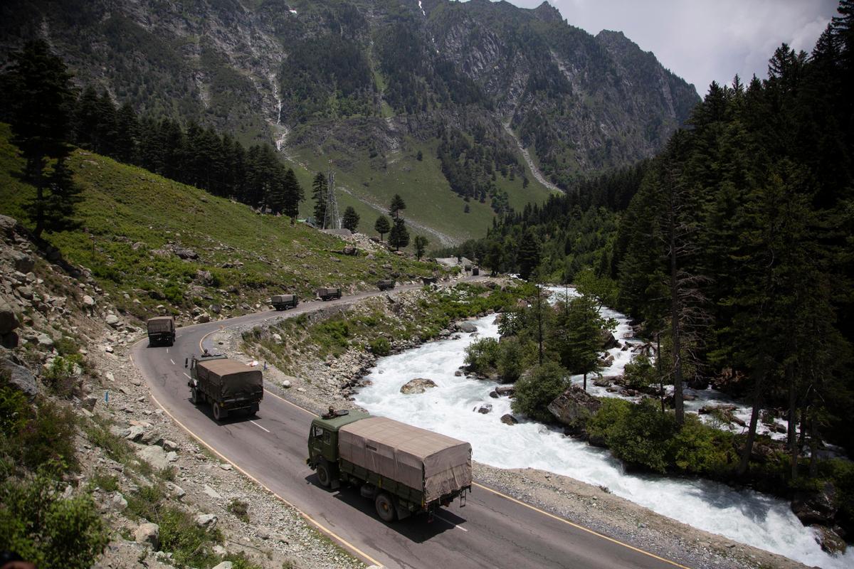An Indian army convoy moves on the Srinagar-Ladakh highway at Gagangeer, northeast of Srinagar, India, on June 17, 2020. (Mukhtar Khan/AP Photo)