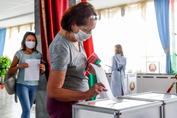 A woman casts her ballot at a polling station during the presidential election in Minsk, Belarus, on Aug. 9, 2020. (Sergei Grits/AP Photo)
