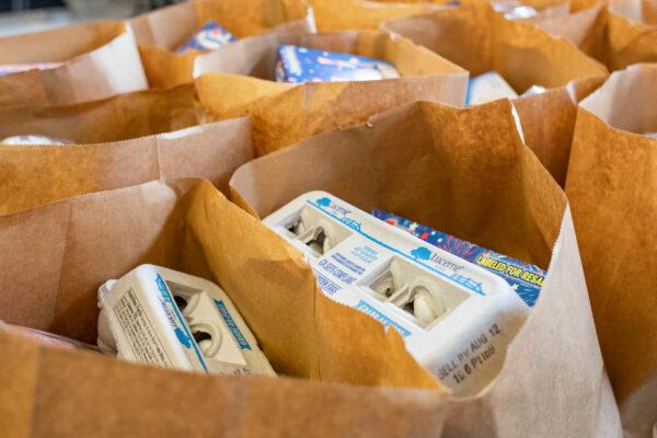 Food bags are prepared for pick-up at Share Our Selves food pantry in Costa Mesa, Calif., on Aug. 17, 2020. (John Fredricks/The Epoch Times)
