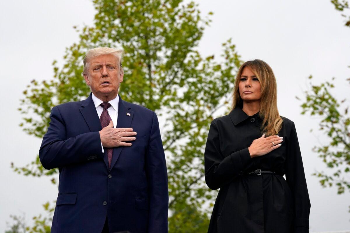 President Donald Trump and First Lady Melania Trump stand during the Pledge of Allegiance at a 19th-anniversary observance of the Sept. 11 terror attacks, at the Flight 93 National Memorial in Shanksville, Pa., on Sept. 11, 2020. (Alex Brandon/AP Photo)