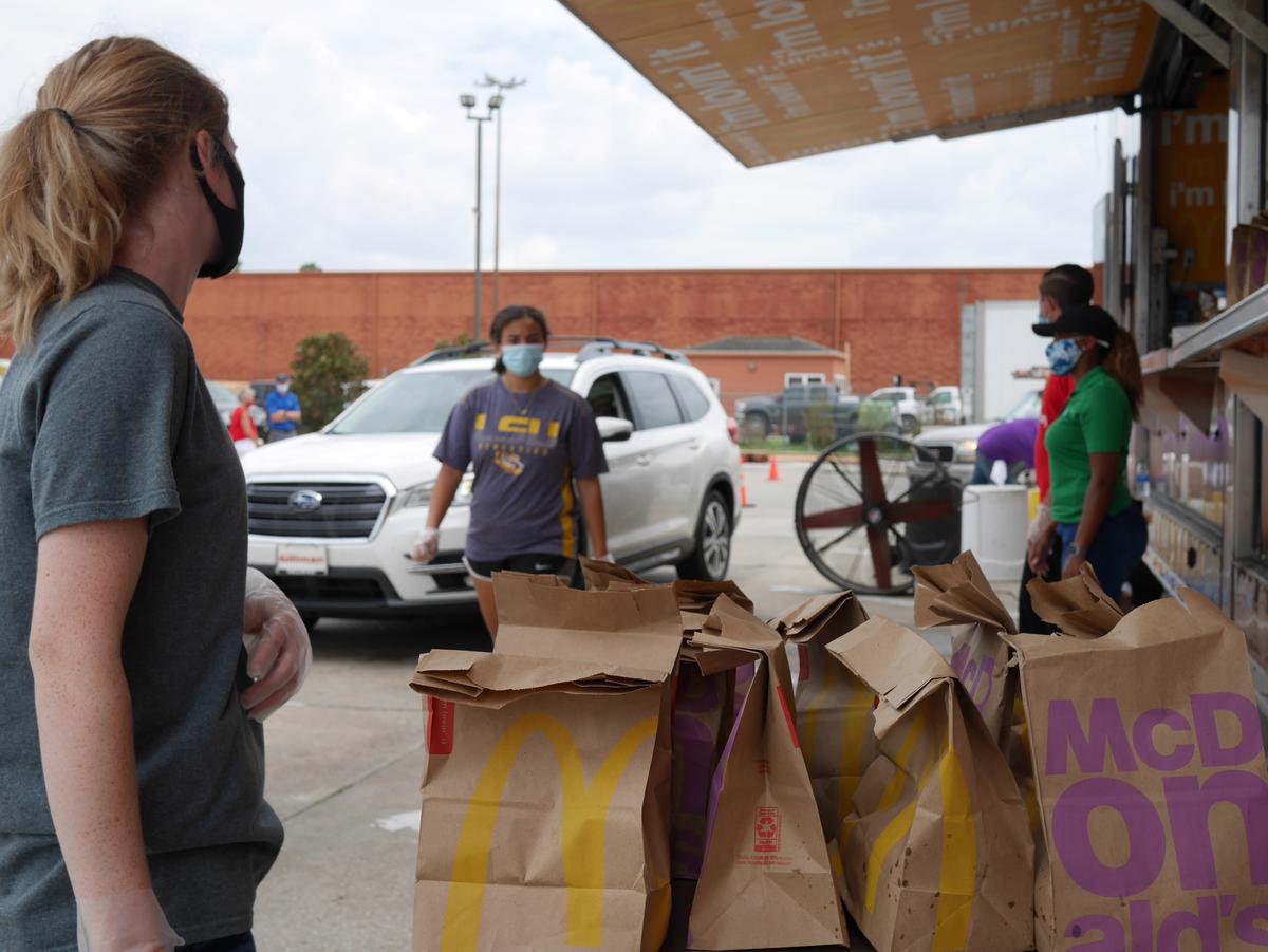 The staff offering brown bag meals to the Lake Charles community. (Courtesy of Patrick Swinney)