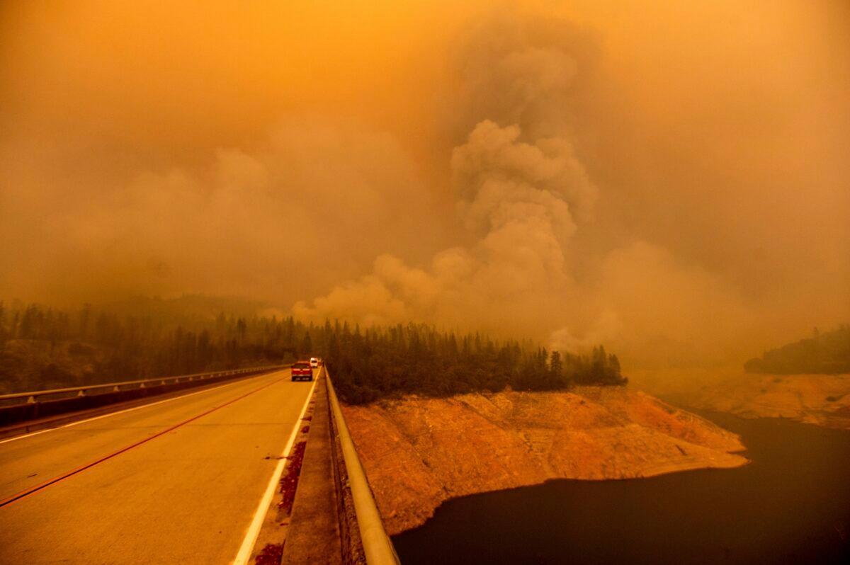 A plume rises from the Bear Fire as it burns along Lake Oroville in Butte County, Calif., on Sept. 9, 2020. (Noah Berger/AP Photo)