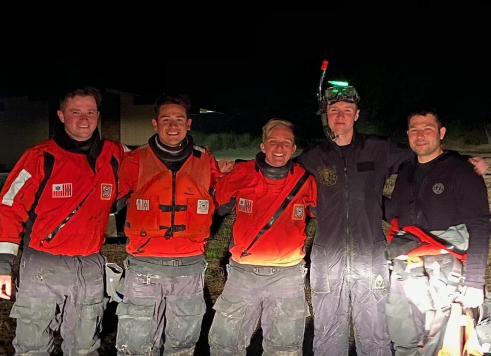 (L–R) Crew members Tyler Hurst, Matthew Roque, Rachel Robbins, Wallace Qual, and Jacob Hylkema from Station Yaquina Bay after rescuing a fisherman near South Beach State Park south of Newport, Ore., on Sept. 8, 2020 (U.S. Coast Guard photo by Station Yaquina Bay)