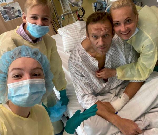 This handout photo published by Russian opposition leader Alexei Navalny on his instagram account, shows himself, centre, and his wife Yulia, right, daughter Daria, and son Zakhar, top left, posing for a photo in a hospital in Berlin, Germany, on Sept. 15, 2020. (Navalny Instagram/AP Photo)