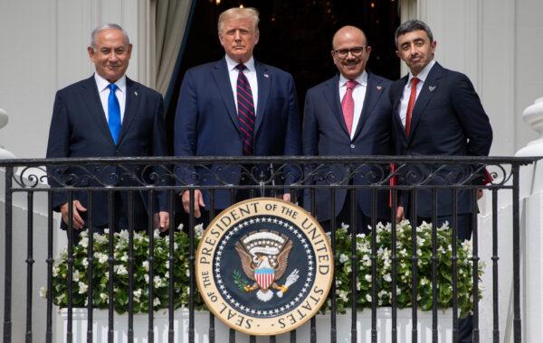 (L-R) Israeli Prime Minister Benjamin Netanyahu, U.S. President Donald Trump, Bahrain Foreign Minister Abdullatif Al Zayani, and UAE Foreign Minister Abdullah bin Zayed Al-Nahyan pose from the Truman Balcony at the White House after they participated in the signing of the Abraham Accords where the countries of Bahrain and the United Arab Emirates recognize Israel, in Washington on Sept. 15, 2020. (Saul Loeb/AFP via Getty Images)