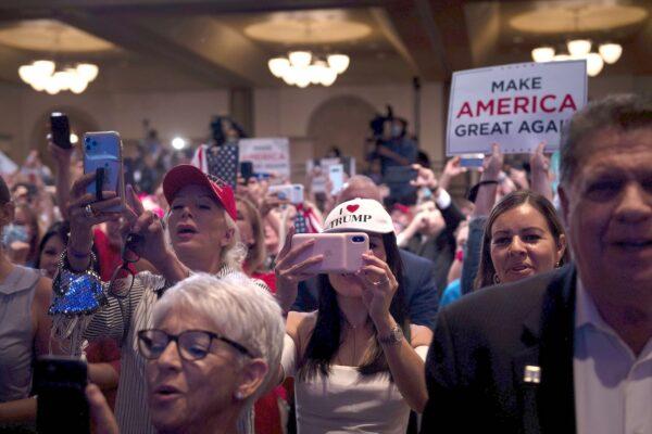 People cheer for President Donald Trump during a roundtable with Latino supporters at the Arizona Grand Resort in Phoenix, Arizona, on Sept. 14, 2020. (Brendan Smialowski/AFP via Getty Images)