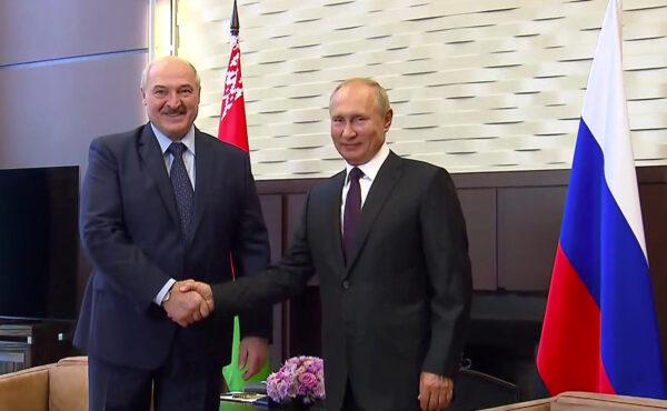 Russia's President Vladimir Putin shakes hands with his Belarusian counterpart Alexander Lukashenko during a meeting in Sochi, Russia, on Sept. 14, 2020, (Russian Presidential Executive Office/Handout via Reuters)