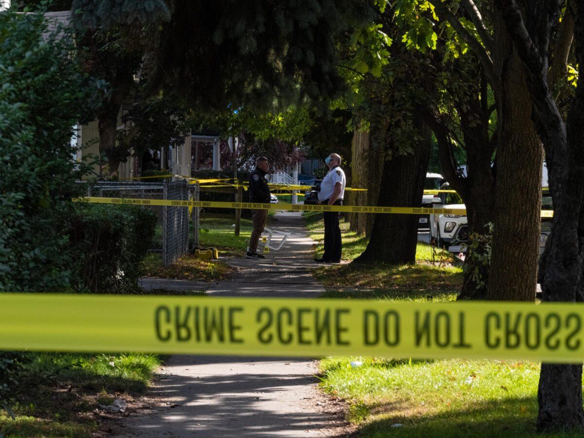 Police officers investigate a crime scene after a shooting at a backyard party in Rochester, N.Y., on Sept. 19, 2020. (Joshua Rashaad McFadden/Getty Images)