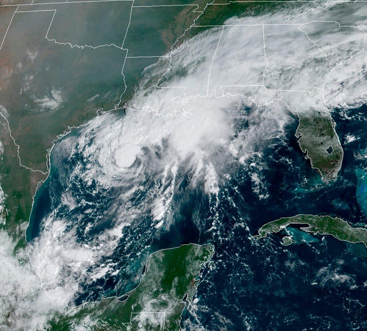 This GOES-16 GeoColor satellite image taken shows Tropical Storm Beta, center, in the Gulf of Mexico, on Sept. 19, 2020. (NOAA via AP)