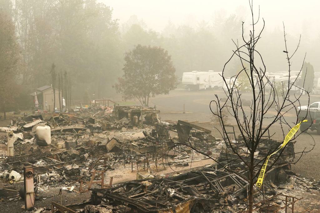 Remains of mobile homes smolder at the Clackamas River RV Park in Estacada, Ore., on Sept. 14, 2020. (Nathan Howard/Getty Images)