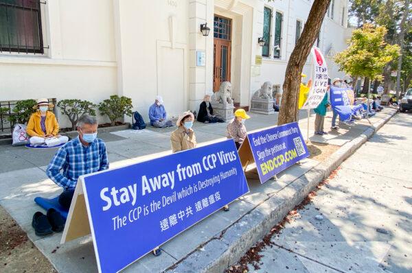 Falun Gong practitioners meditate in front of the Chinese Consulate in San Francisco on Sept. 21, 2020. (Ilene Eng/The Epoch Times)
