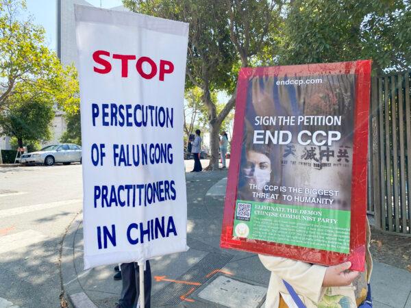 Falun Gong practitioners and their supporters hold banners and signs in front of the Chinese Consulate in San Francisco on Sept. 21, 2020. (Ilene Eng/The Epoch Times)