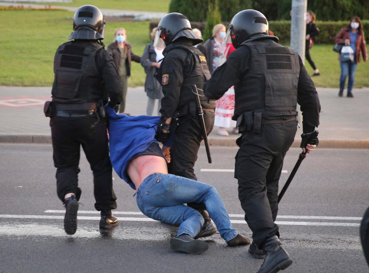 Riot police detain a protester during an opposition rally to protest the presidential inauguration in Minsk, Belarus, on Sept. 23, 2020. (TUT.by/AP Photo)
