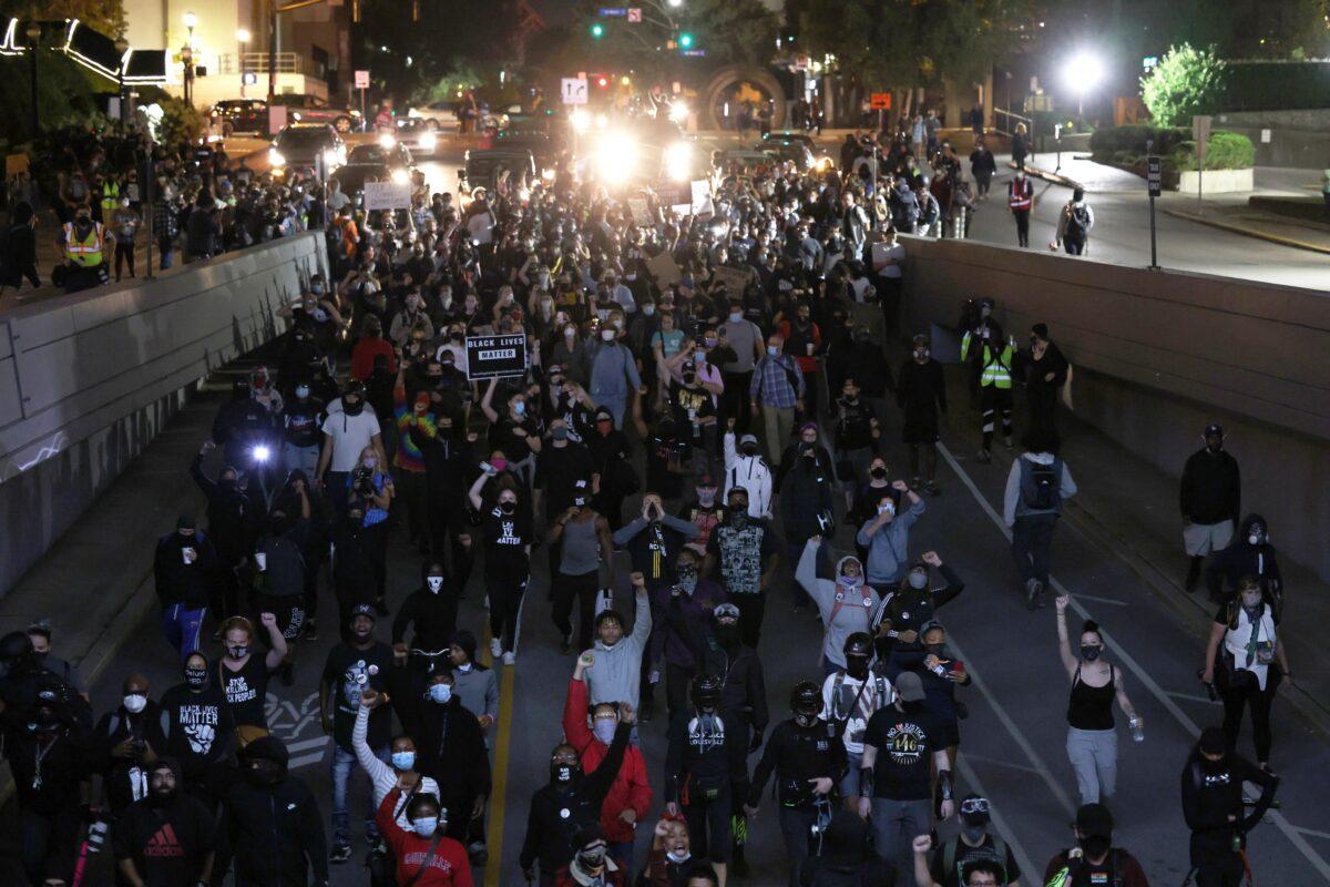 Demonstrators march through the streets in Louisville, Ky., Sept. 24, 2020. (Michael M. Santiago/Getty Images)