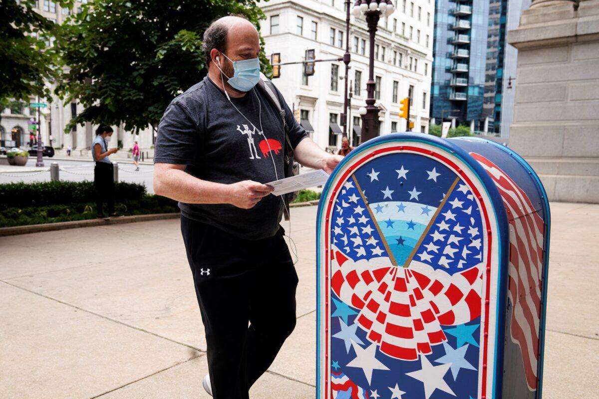 A man casts his ballot in the primary election in Philadelphia, Penn., June 2, 2020. (Joshua Roberts/Reuters)