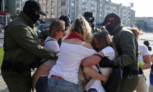 Belarusian law enforcement officers block women during an opposition rally to reject the presidential election results and to protest against the inauguration of President Alexander Lukashenko in Minsk, on Sept. 26, 2020. (Tut.By via Reuters)