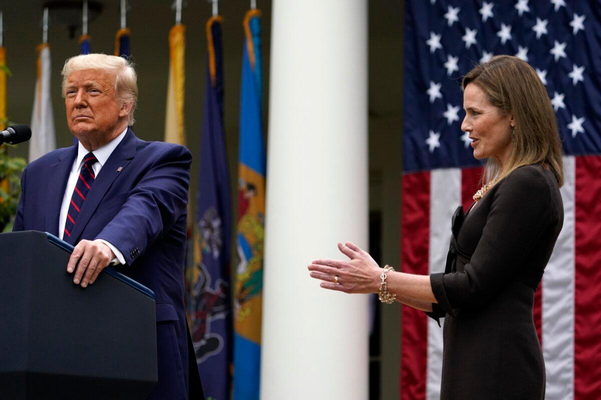 Judge Amy Coney Barrett applauds as President Donald Trump announces her as his nominee to the Supreme Court, in the Rose Garden at the White House on Sept. 26, 2020. (Alex Brandon/AP Photo)