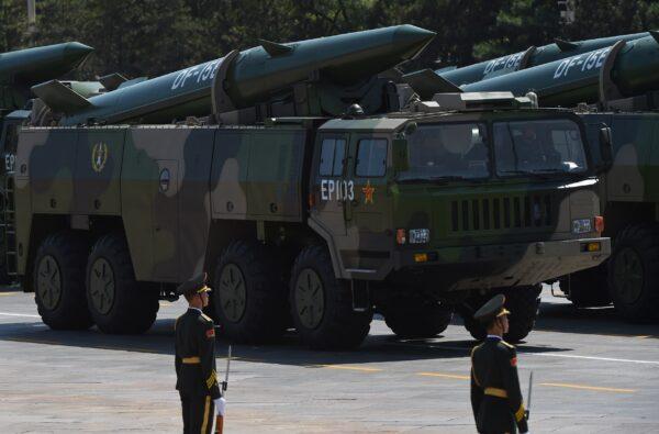 Military vehicles carrying DF-15B ballistic missiles—replacement of DF-11—participate in a military parade at Tiananmen Square in Beijing on Sept. 3, 2015. (GREG BAKER/AFP via Getty Images)