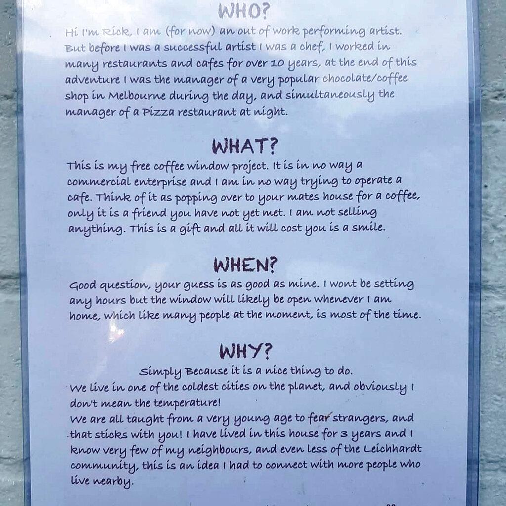 A sign describing Rick Everett's complimentary coffee and conversation window hangs on the side of his home in Sydney, Australia. (Rick Everett via AP)