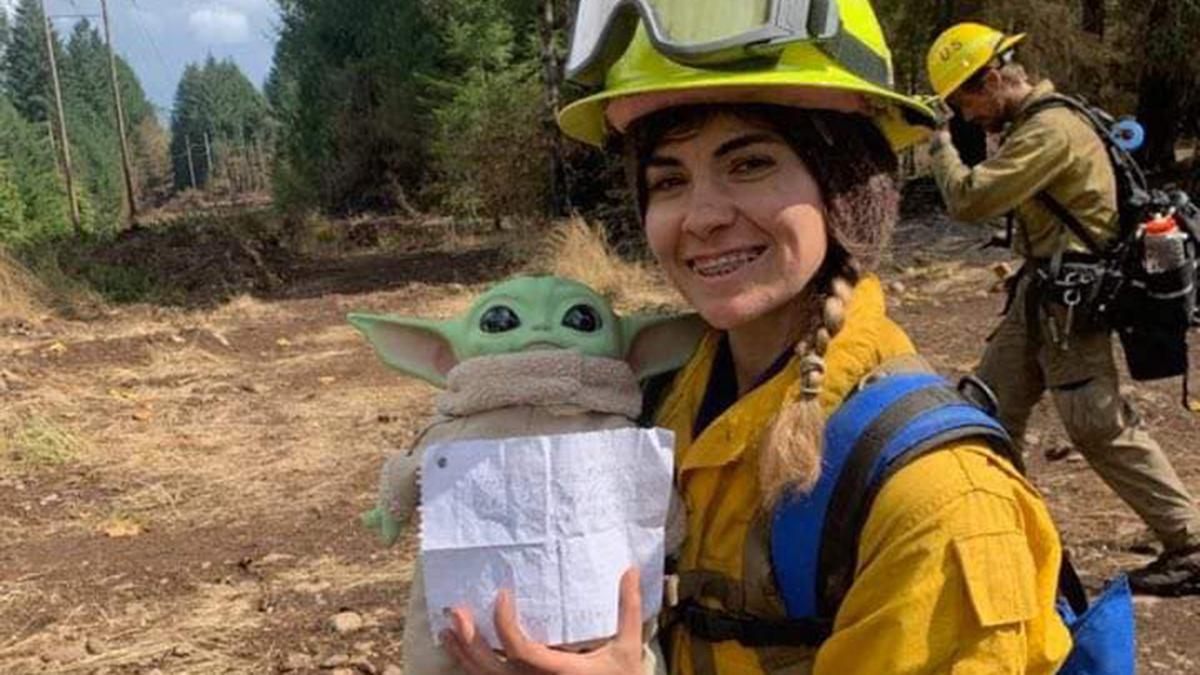 Firefighters take turns carrying Baby Yoda on front line expeditions. (Courtesy of Tyler Eubanks)