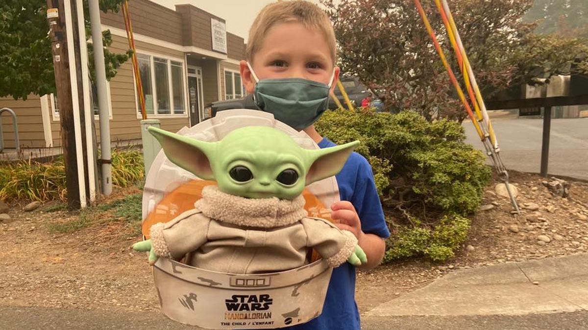 Carver, 5, with Baby Yoda before sending his care package. (Courtesy of Tyler Eubanks)