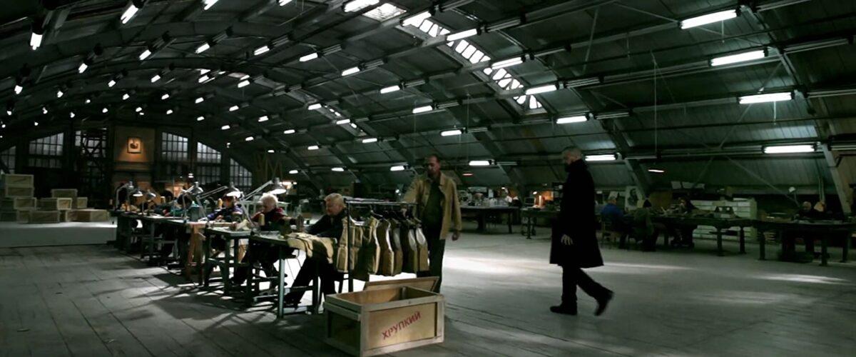Abu Shabal (Jason Cottle, R) approaches his team of terrorists manufacturing undetectable explosive vests, in "Act of Valor." (Relativity Media).